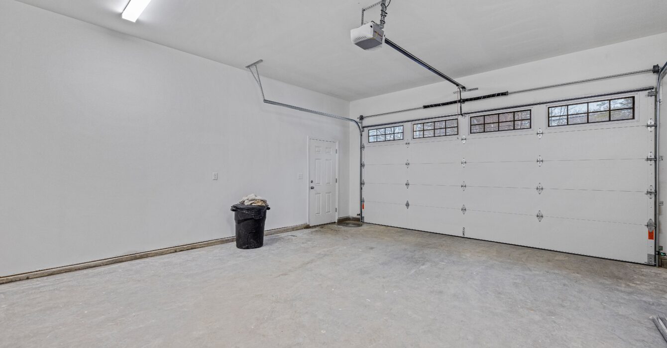 Empty white garage with windows