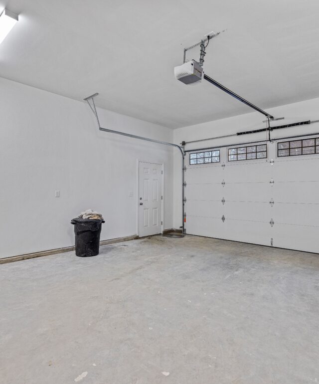 Empty white garage with windows