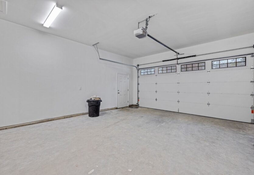 Empty white garage with windows
