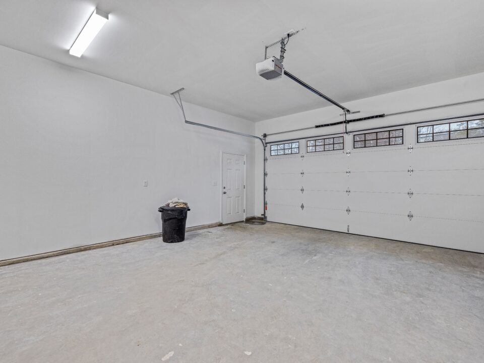 Empty white garage with windows