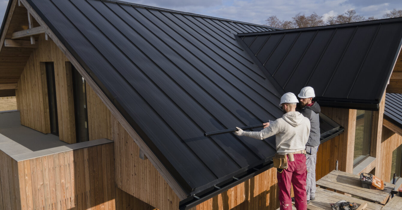 full-shot-roofers-working-together-with-helmets full-shot-roofers-working-together-with-helmets