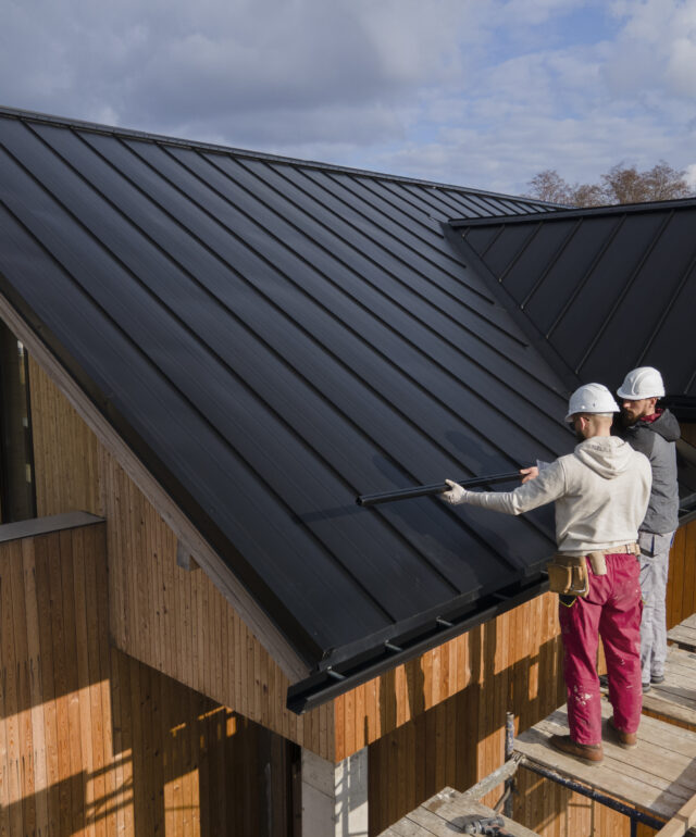 full-shot-roofers-working-together-with-helmets