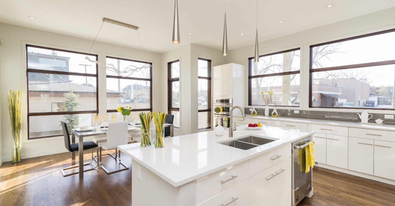 Interior shot of a modern house kitchen with large windows Interior shot of a modern house kitchen with large windows