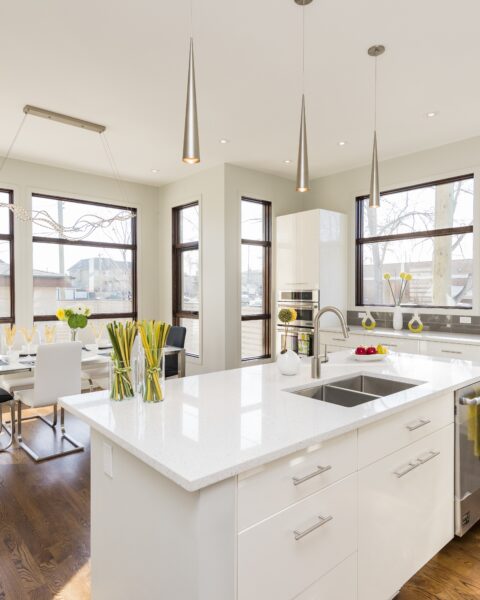 Interior shot of a modern house kitchen with large windows