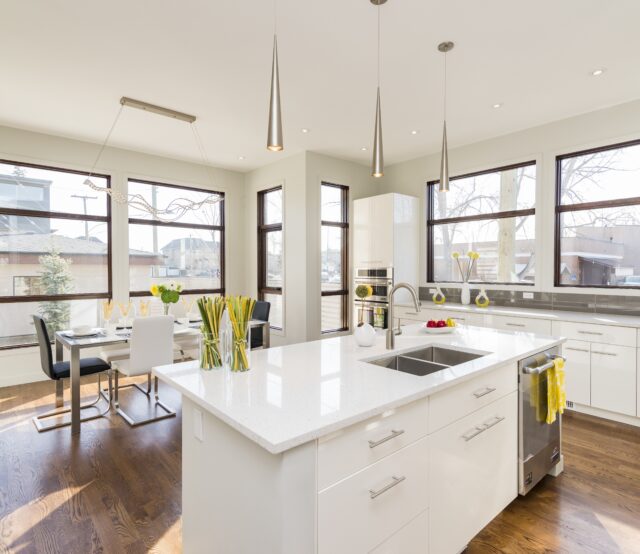 Interior shot of a modern house kitchen with large windows