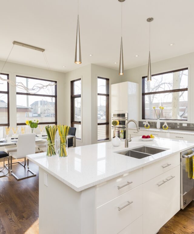 Interior shot of a modern house kitchen with large windows